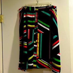 Below the knee, wide, multi colored skirt.